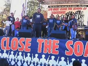 Delegation of Coalition of Immokolee workers<br>speak at anti-SOA rally Nov. 20. 