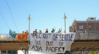 Banner drop targets APEC