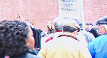 Community, unionists march on bank to stop foreclosure